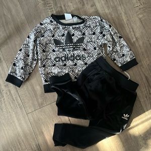 Adidas. Size 3-4. Good condition. Barely worn. Black pants and zebra print top.